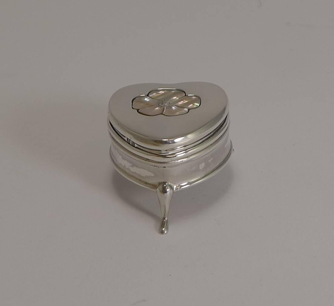 Made from English sterling silver, it stands on three pretty legs and is fully hallmarked for Birmingham 1909, Edwardian in era; the makers initials are also present for the well renowned silversmith, Cornelius Desormeaux Saunders & James Francis