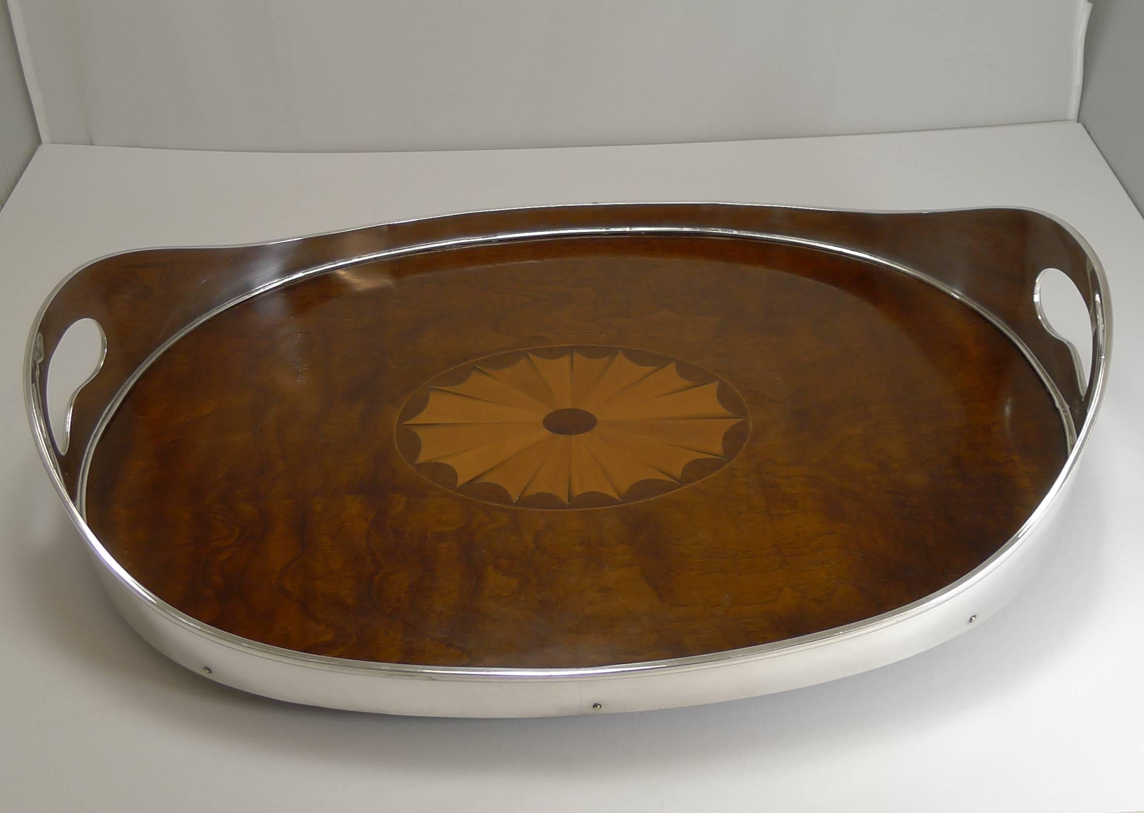 A fabulous look for any home, perfect for the traditionalist and simple and elegant for the contemporary interior.

Made from stained mahogany and inlaid with a splendid large fan motif, dating the tray to circa 1890-1900, late Victorian or