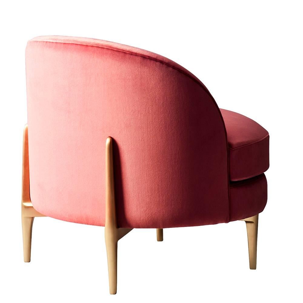 The Belle Side Chair by DeMuro Das has an elliptical shaped seat with standard or feather/down cushion and curved back. Hand-cast solid bronze legs extend up the back of the seat, making this piece interesting from all angles. Construction includes