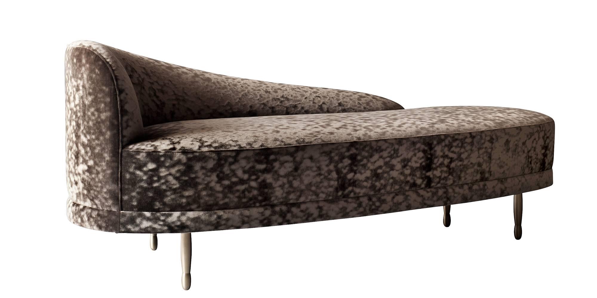 The Claire Chaise by DeMuro Das has a curved back and seat and sculptural solid bronze legs in Satin finish. Construction includes solid hardwood frame with European webbing and multi-density foam.

Pricing is quoted COM - does not include fabric