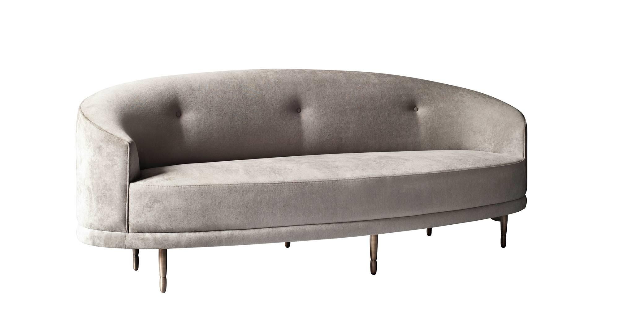 The Claire sofa by DeMuro Das has a crescent-shaped back supported by six solid bronze legs with an antique finish. Construction includes solid hardwood frame with European webbing and multi-density foam.
 
Pricing is quoted COM - does not include