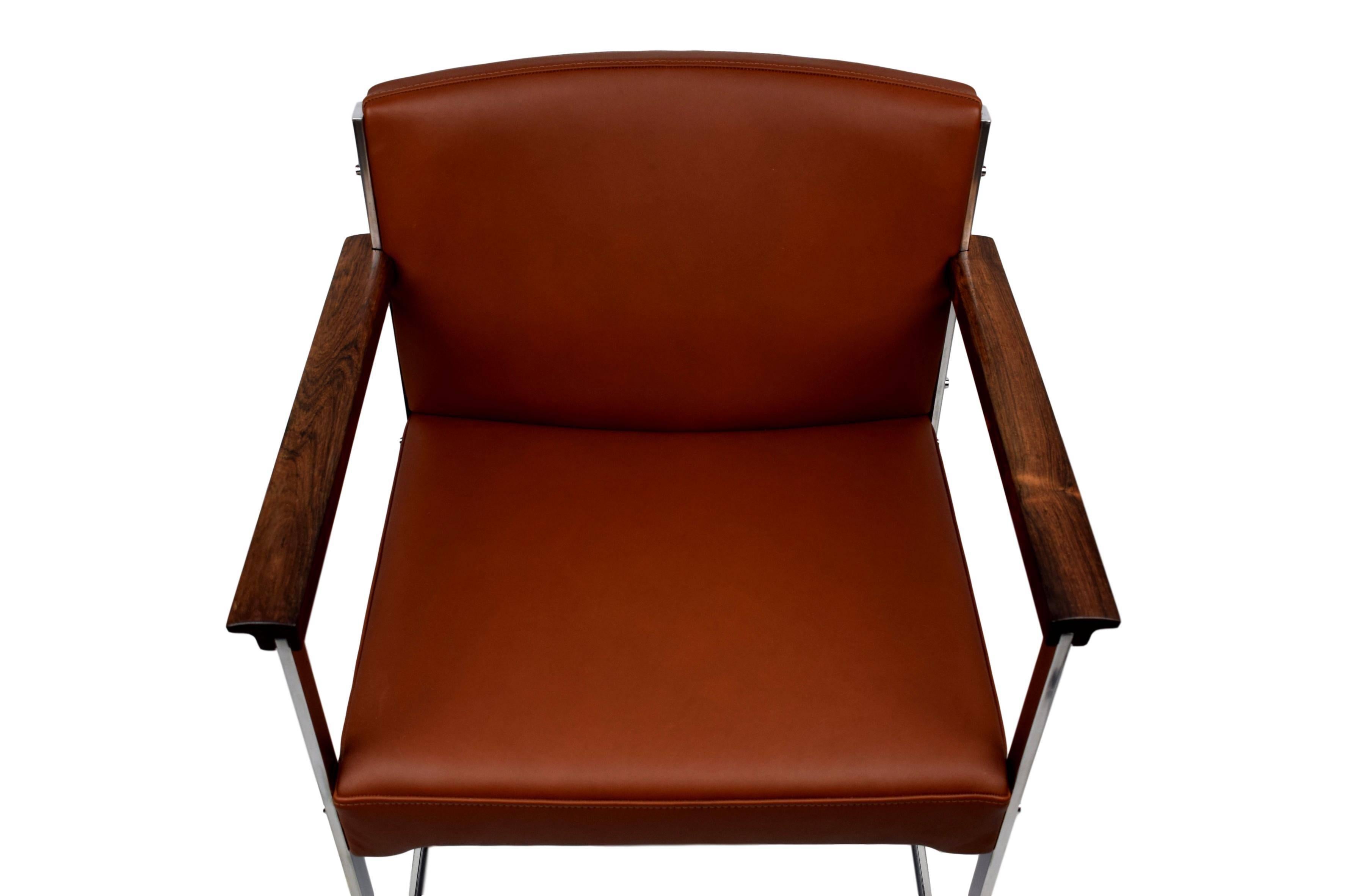 A Danish midcentury armchair by Illum Wikkelsø (1919-1999). Produced by P. Schultz & Co. Steel frame with solid rosewood armrests. Newly upholstered with brown aniline leather. New foam in the seat and backrest.

Multible chairs available. Please