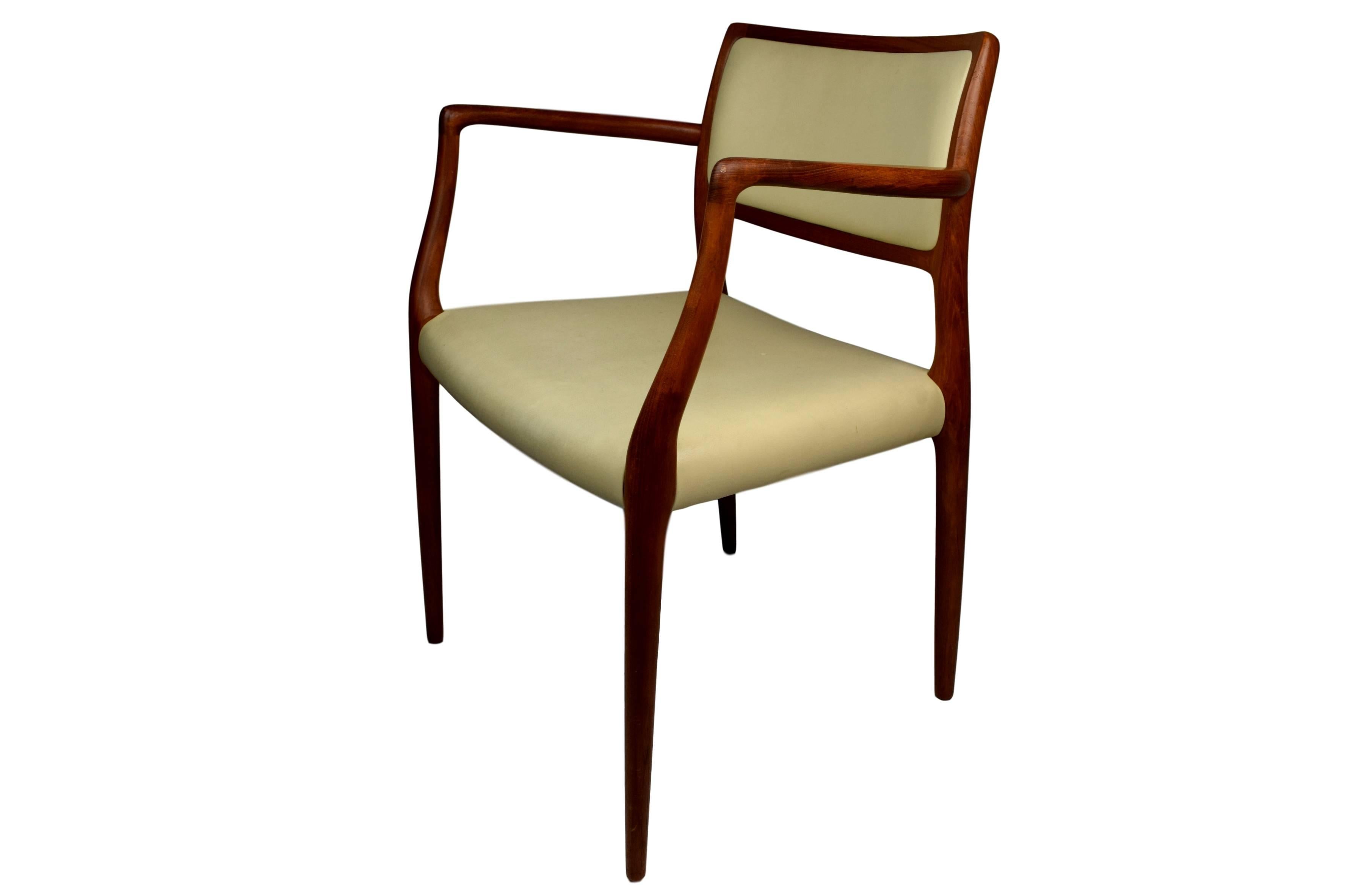 An armchair by Niels O. Møller. Model 65. Teak frame upholstered with beige leather. Design from 1968. Produced by J.L. Møllers Møbelfabrik. Stamped 