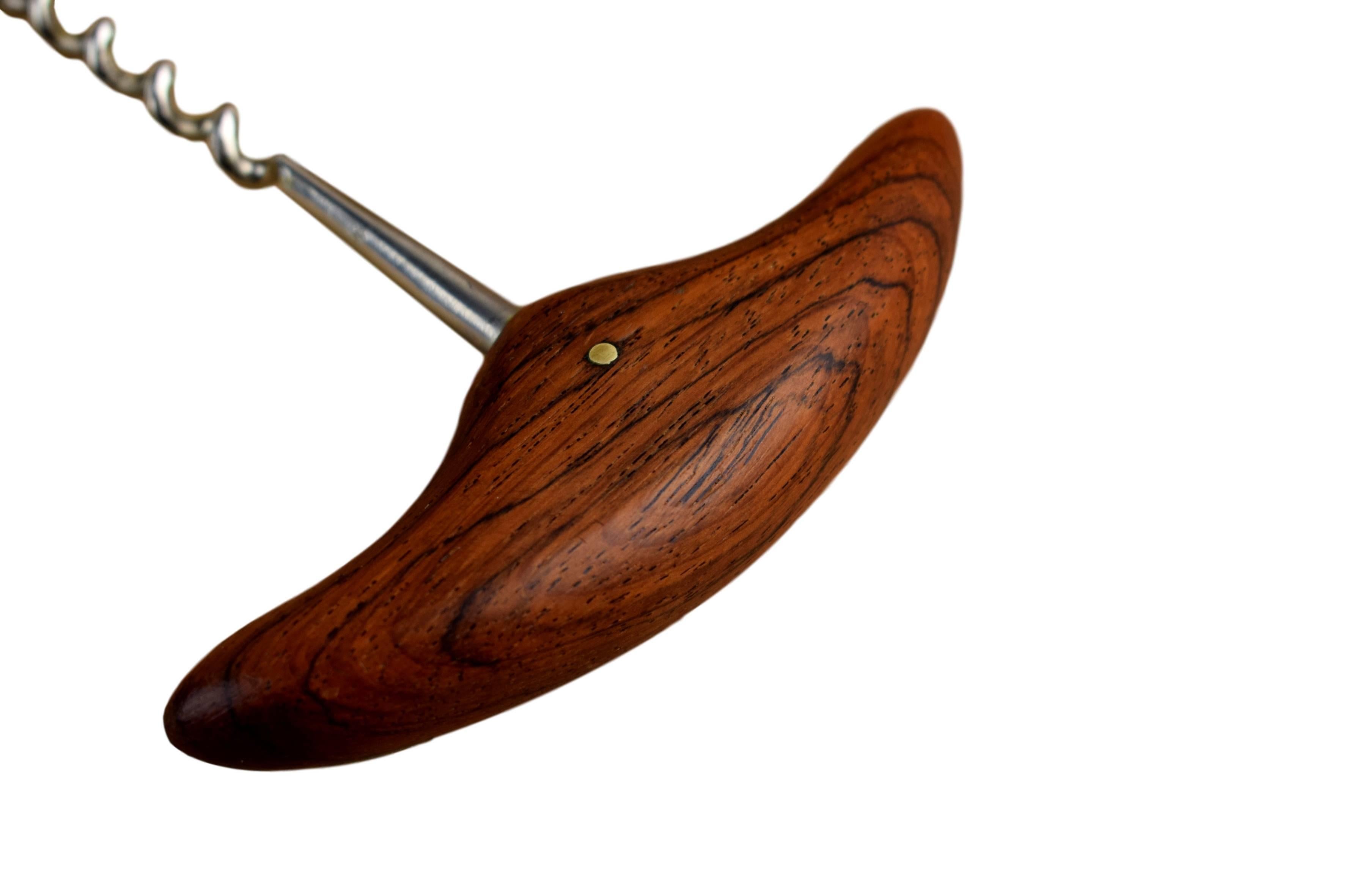 A set of corkscrew and bottle opener with rosewood handles by Kay Bojesen (1886-1958). Produced by Universal Steel company. Bottle opener marked 