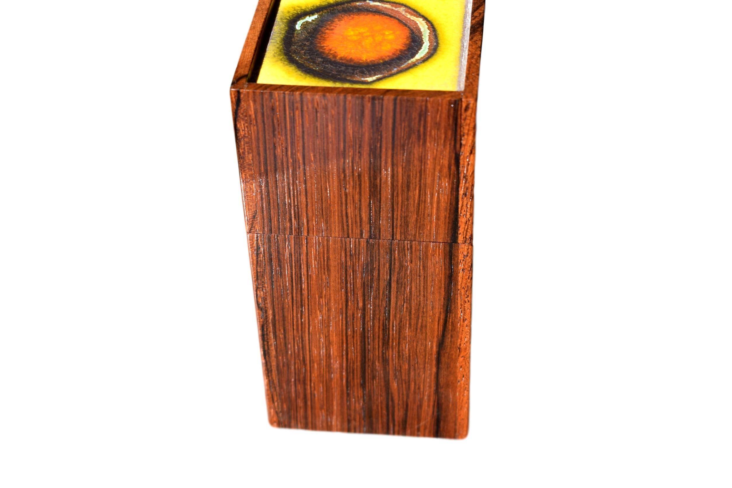 A unique Danish midcentury rosewood box by Alfred Klitgaard with decorative enamel by Danish artist Bodil Eje.

Stamped 