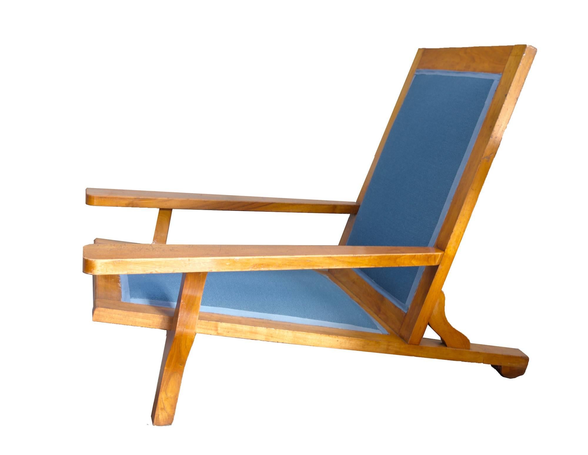 A pair of wooden vintage lounge chairs. Upholstery redone with renowned Kvadrat fabric.