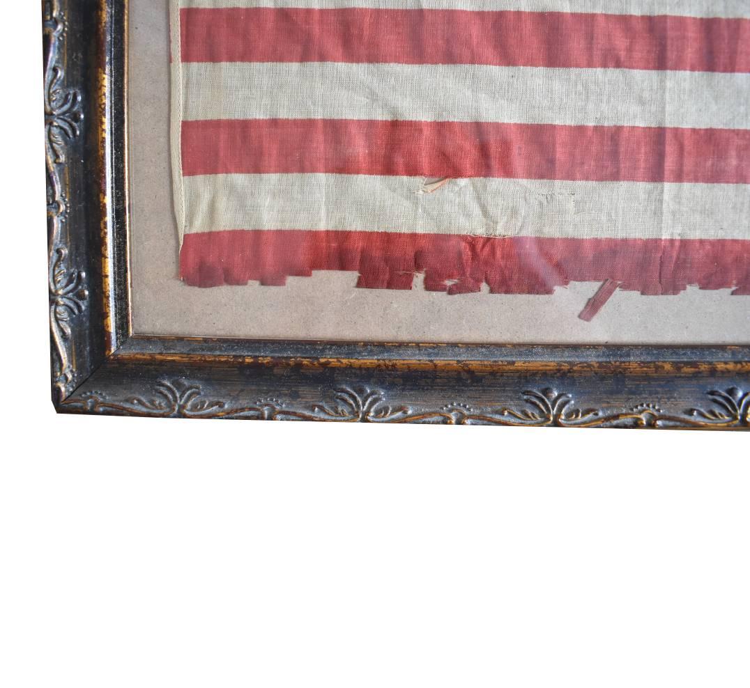 This is an original 1907 - 1912 46-star flag made of cotton and made after Oklahoma was brought into the union. The stars are arranged in an 8-7-8-8-8-7-8 pattern. The stars in the first and sixth rows are canted to the 11:00 position, and the stars