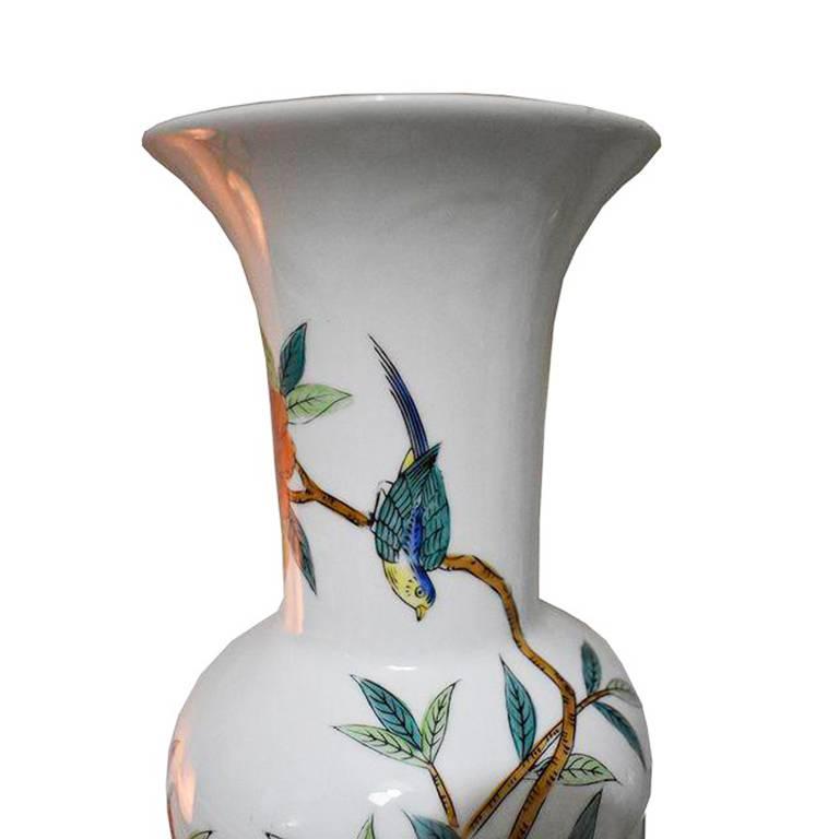 For offer is a gorgeous hand-painted vase. The piece features chrysanthemums in both yellow and orange as well as a bird. Would be great on a mantel, dining table with a bouquet of fresh flowers or a nightstand or coffee table.