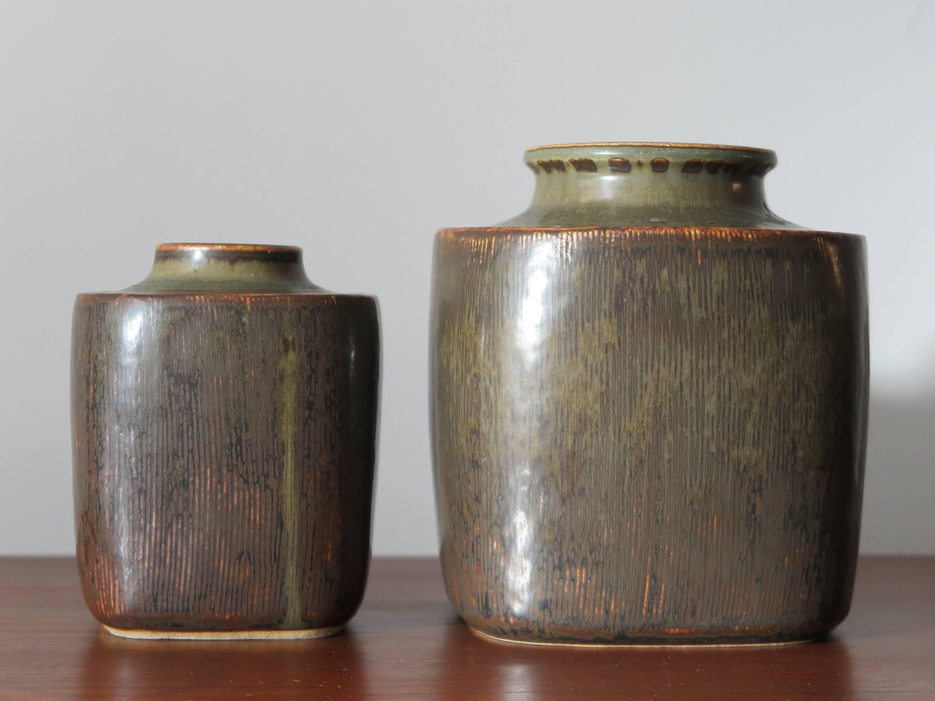 Set of two vintage Scandinavian stoneware amazing big vases designed by the Danish artist Valdemar Petersen for Bing & Grondahl from the 1960s in Copenhagen with matt glazed and with signature engraved on the bottom.
Measurement:
- Medium vase H.