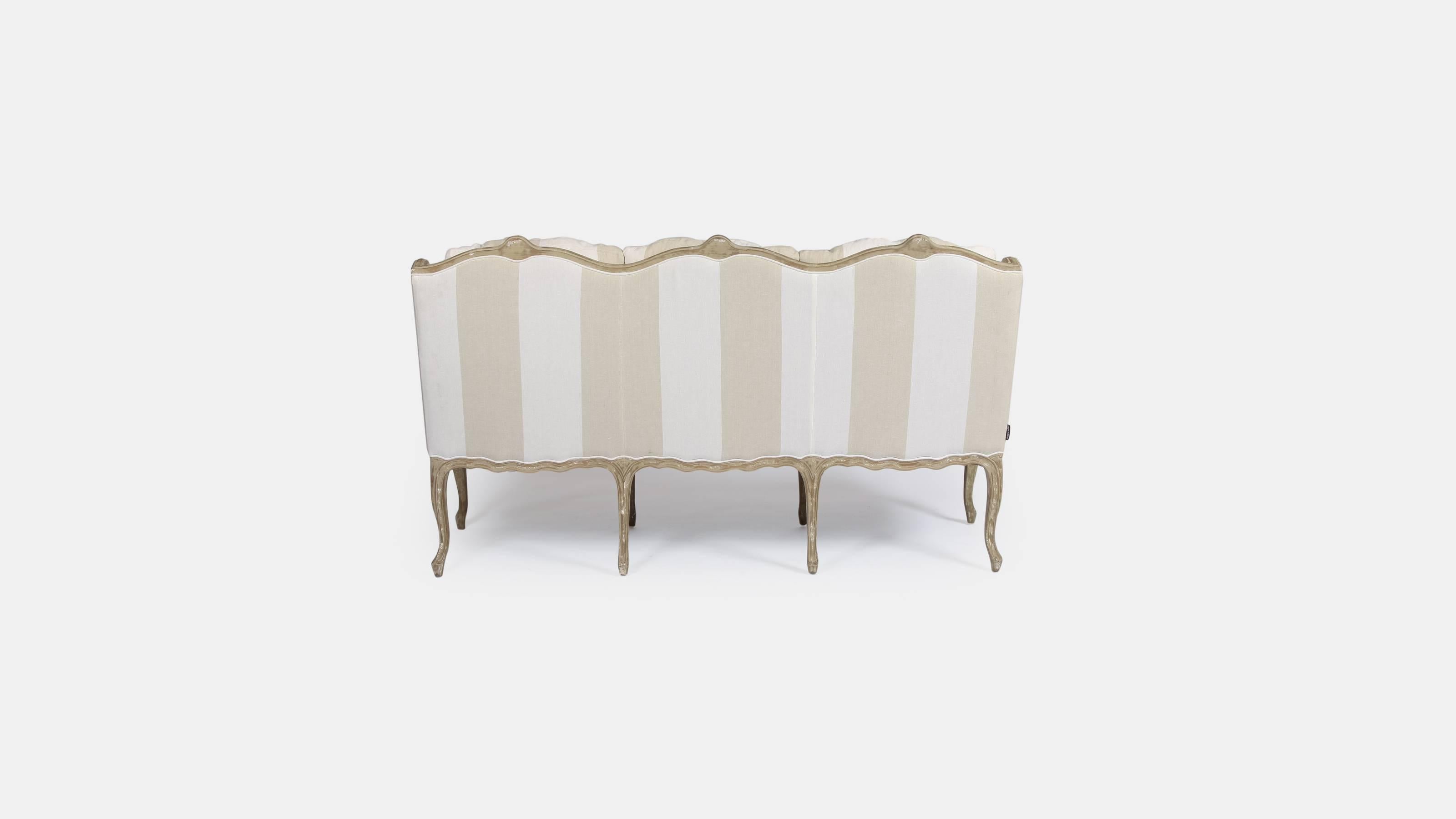 A beautiful stripe linen upholstered three-seat settee by Andrew Martin.

This settee would be a great addition to any hallway, bedroom or drawing room.