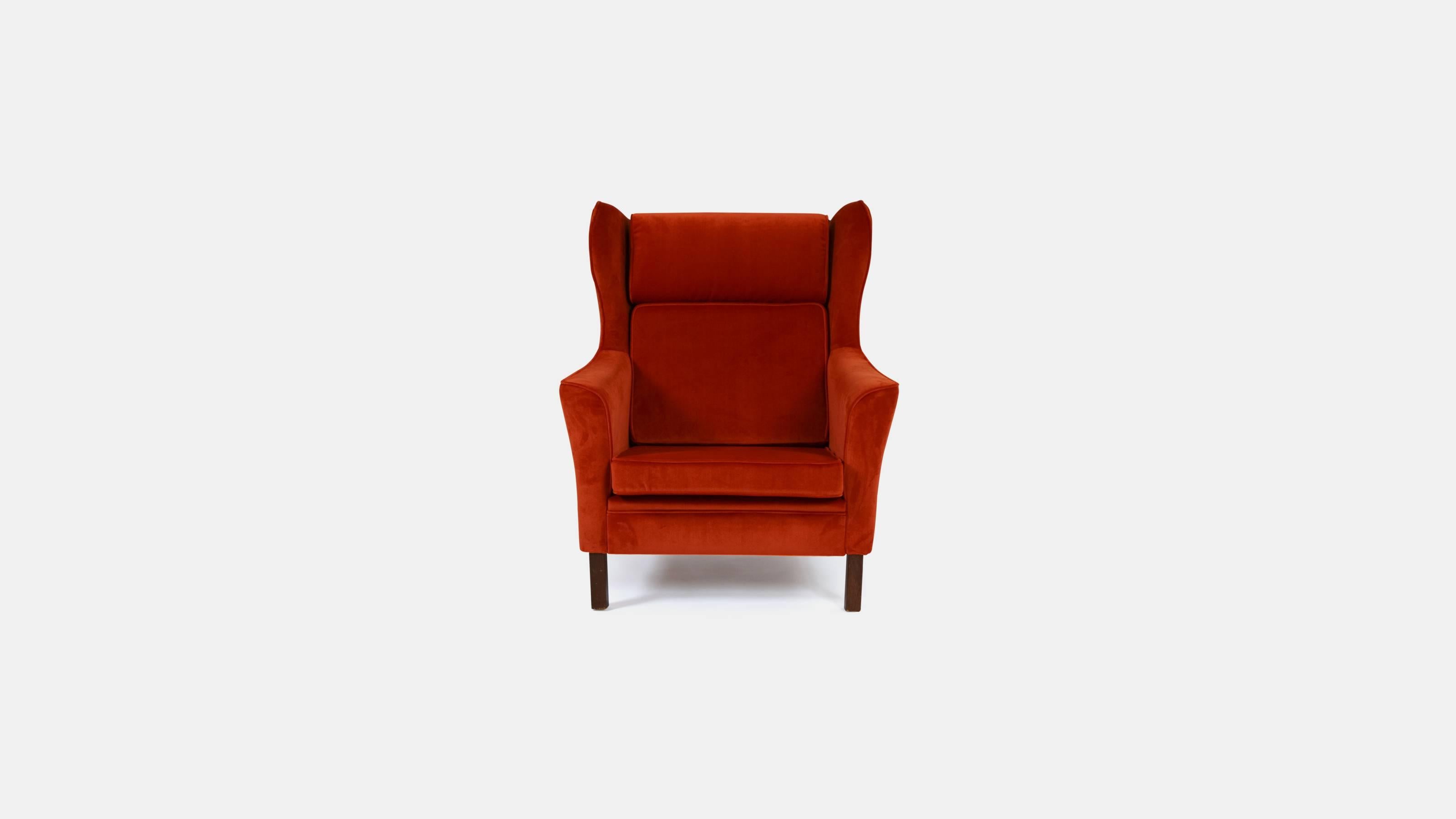 Stunning pair of 1970s Danish wingback lounge armchairs on square straight feet and re-upholstered in orange velvet.

Perfect to accompany your sitting room sofa or hallway. Need a flash of color? These are your chairs!

Get a midcentury look