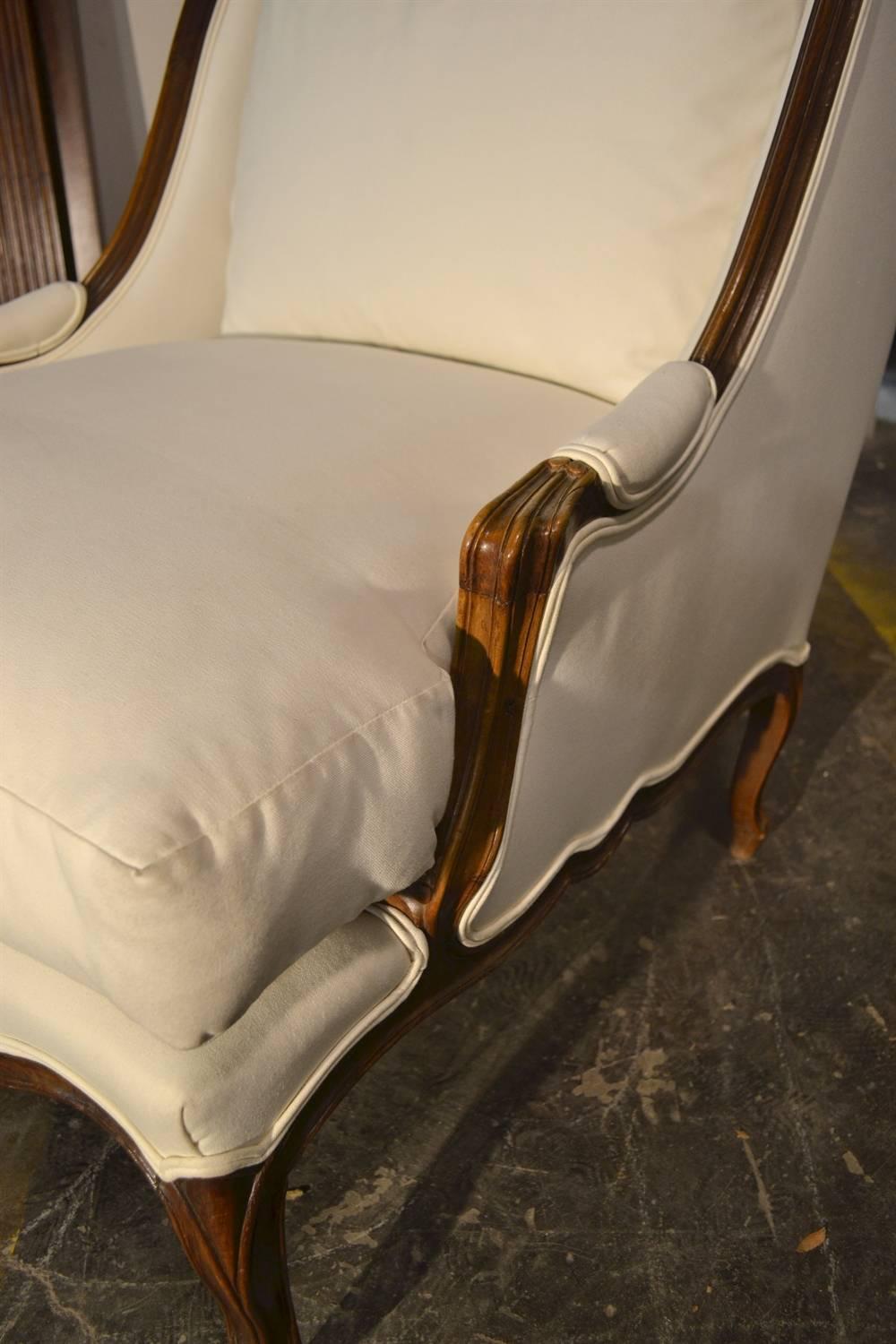 This deep and comfortable chair has a wonderful presence and was purchased in Paris. It's an early 20th Century piece that has been fully reworked and covered. It's in good condition and can be re-upholstered for an additional charge.
