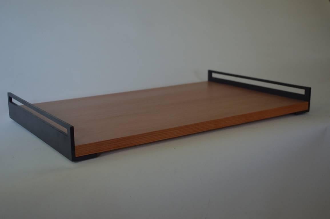 The Fir Tray, an original design offered exclusively by Vermontica, is designed and produced in Vermont by Scott Gordon. A conventional style dressed up nicely with a douglas fir platform fitted to blackened steel handles.

This is a sample being