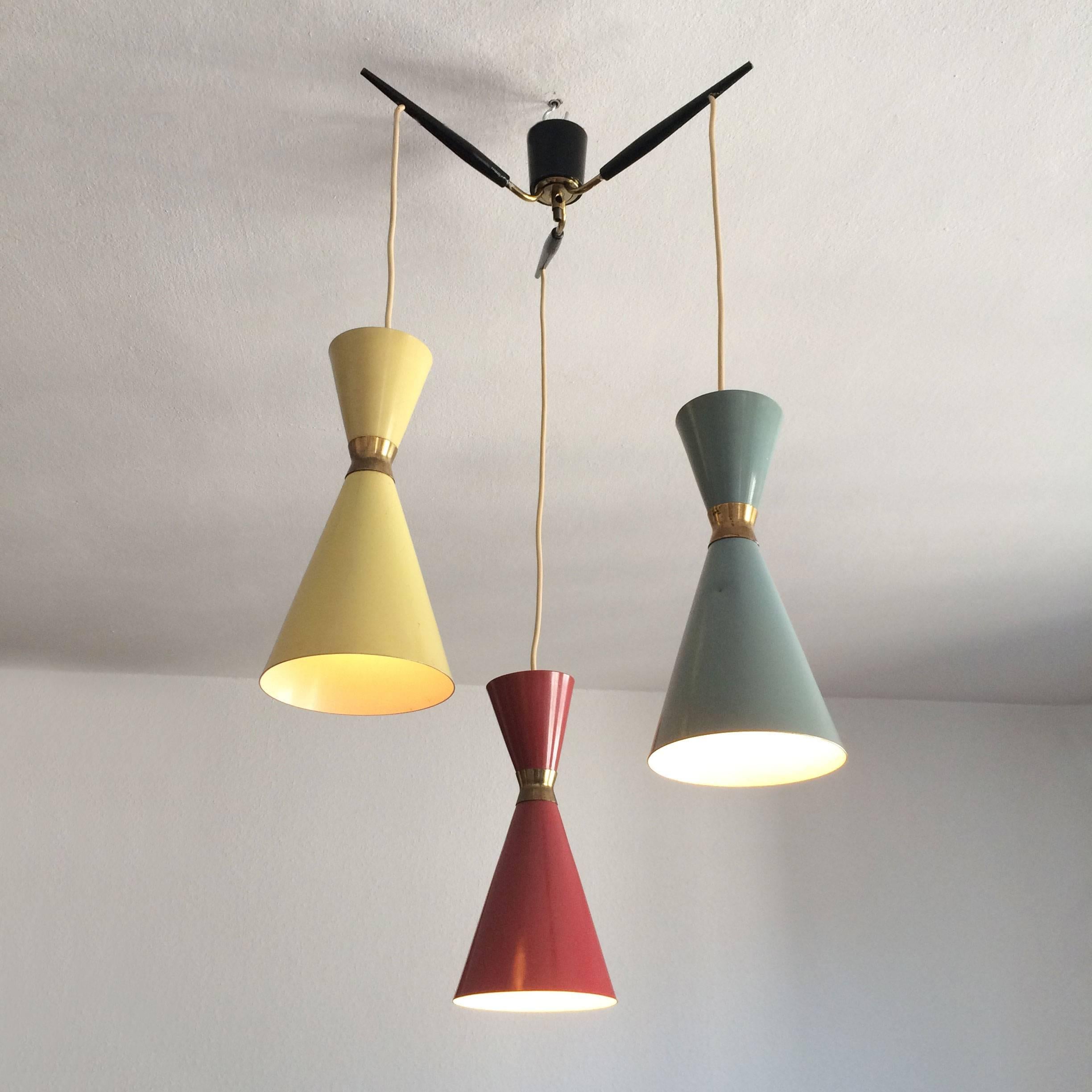 Polychrome pendant lamp with green, red, yellow colored diabolo shades. Manufactured by Bünte & Remmler, Germany in 1950s. Each shade is executed with one E14 screw fit bulb.
