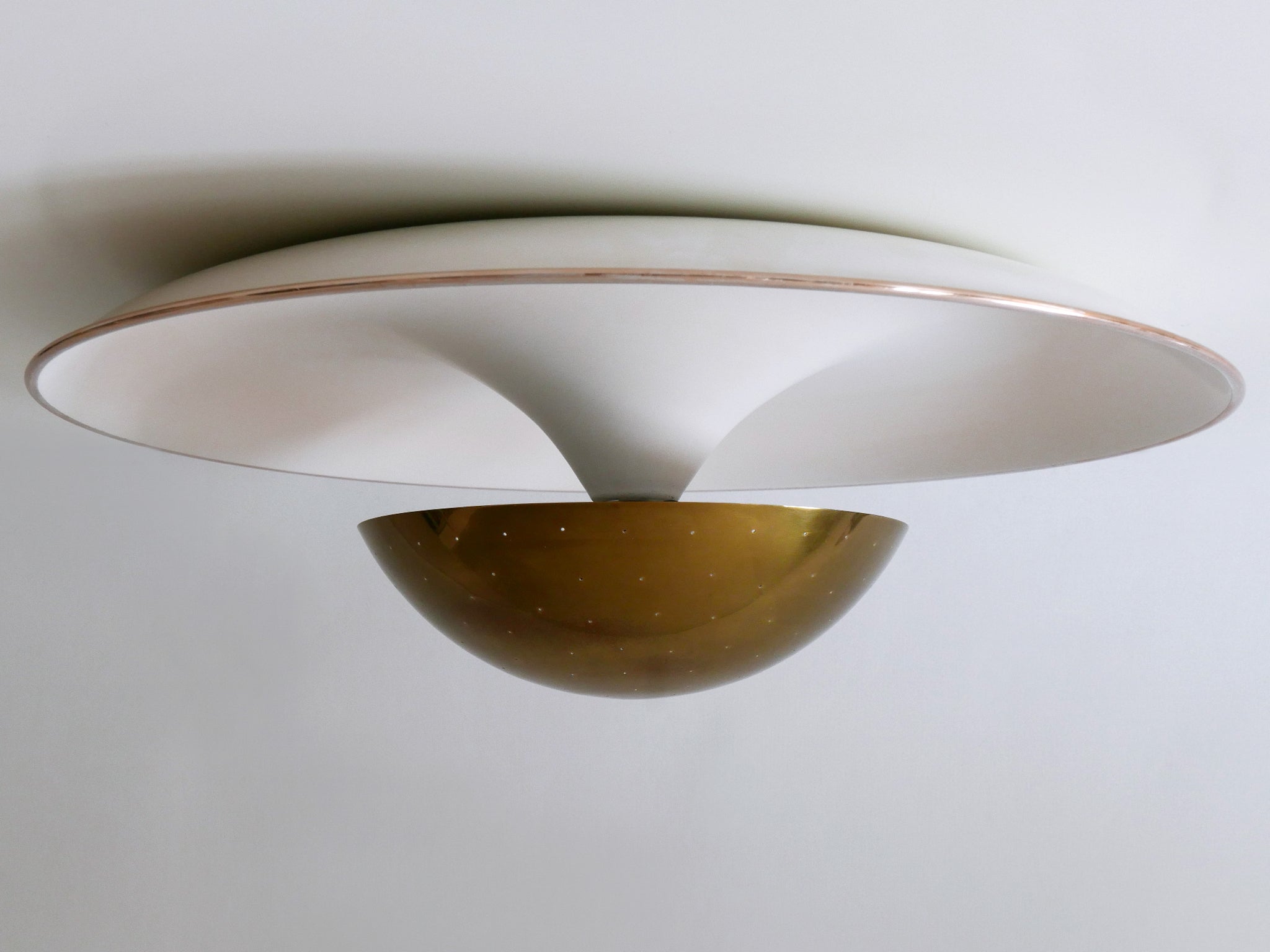 Extremely rare, large and elegant Mid-Century Modern flush mount or sconce in style of Gino Sarfatti Model #155. With perforated brass diffusor. This is a very impressive and decorative piece of German design. Designed 1954 and manufactured by Bünte