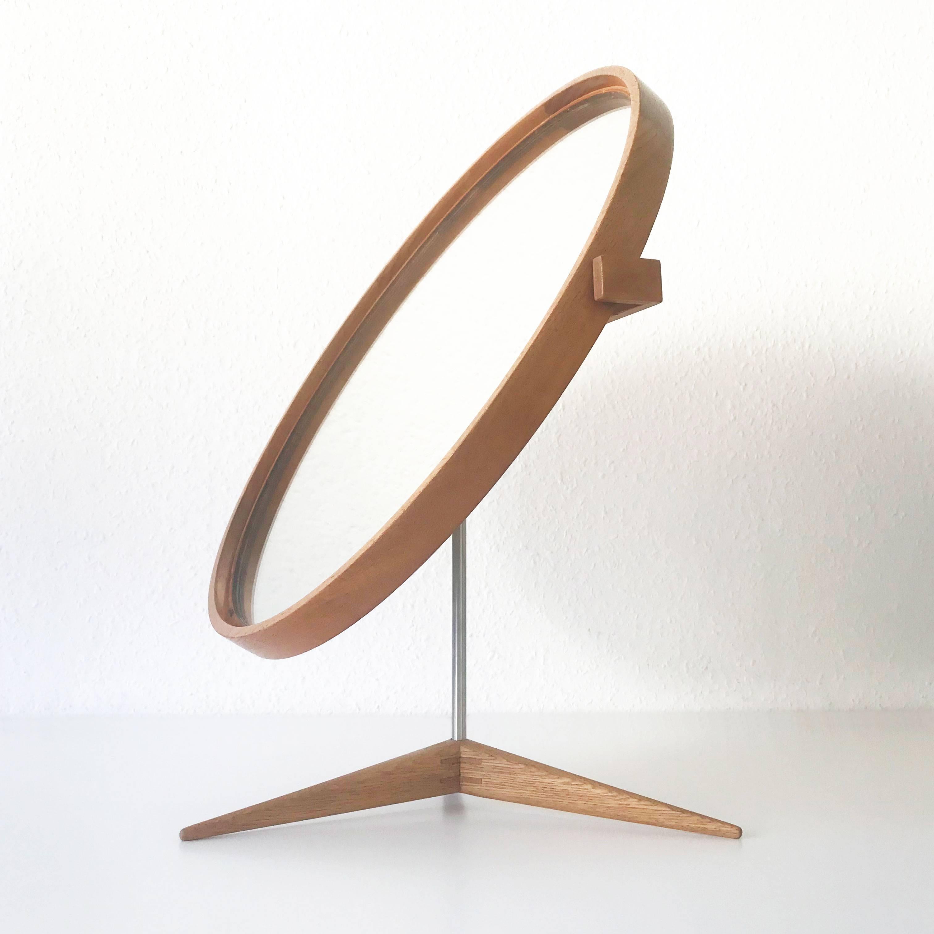 Large, elegant and adjustable table mirror with oak wood frame. Designed by Uno & Östen Kristiansson for Luxus, Vittsjö, Sweden, 1960s.

Executed in oak wood, mirror glass and metal.

Condition:
Good  original vintage condition. Wear consistent with