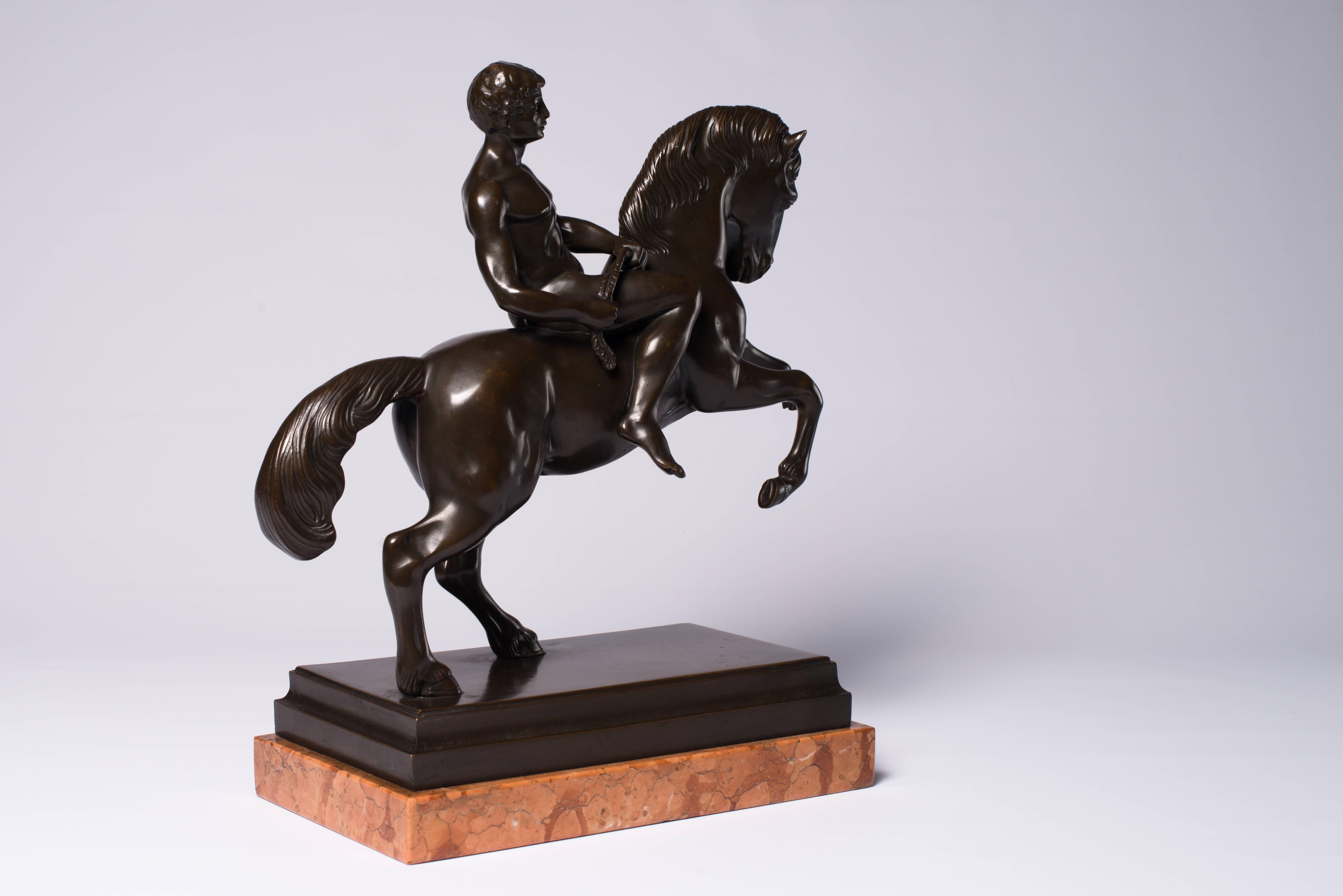 This Italian statue, an athlete on a horse, is a model inspired after the Roman and Greek antique.These kind of statues have always been popular in the Renaissance Baroque period, as a matter of fact the first revival. 
In the Regency Empire