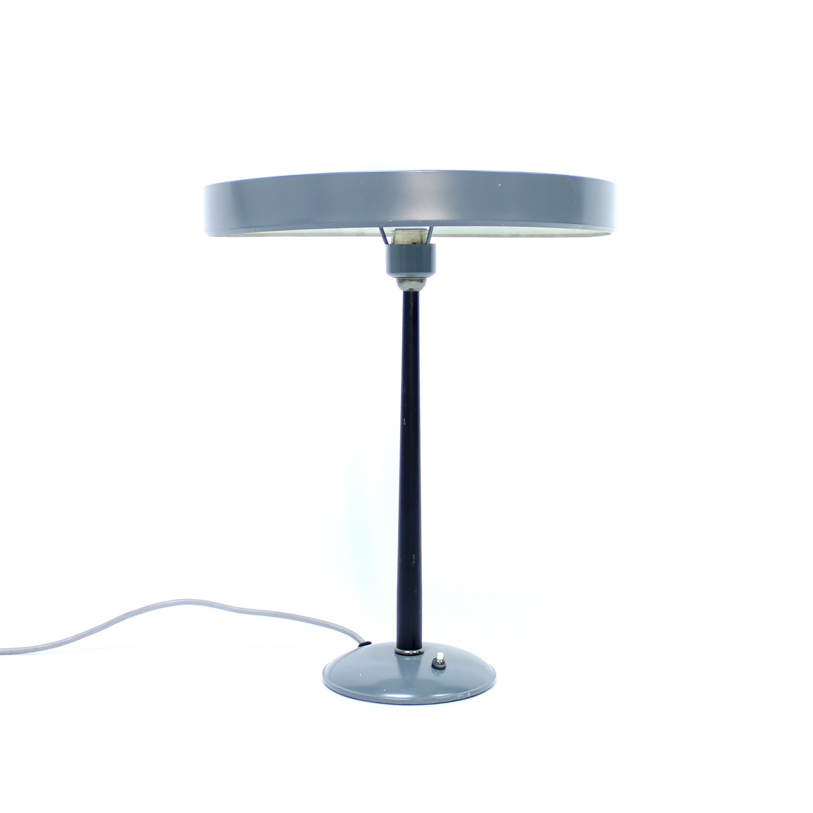 Timor table lamp from the 1930s designed by Louis Kalff for Philips with a round sheet metal shade one a chromed stem mounted to a metal base. Later cord and plug. Good vintage condition with normal ware consistent with age and use. 