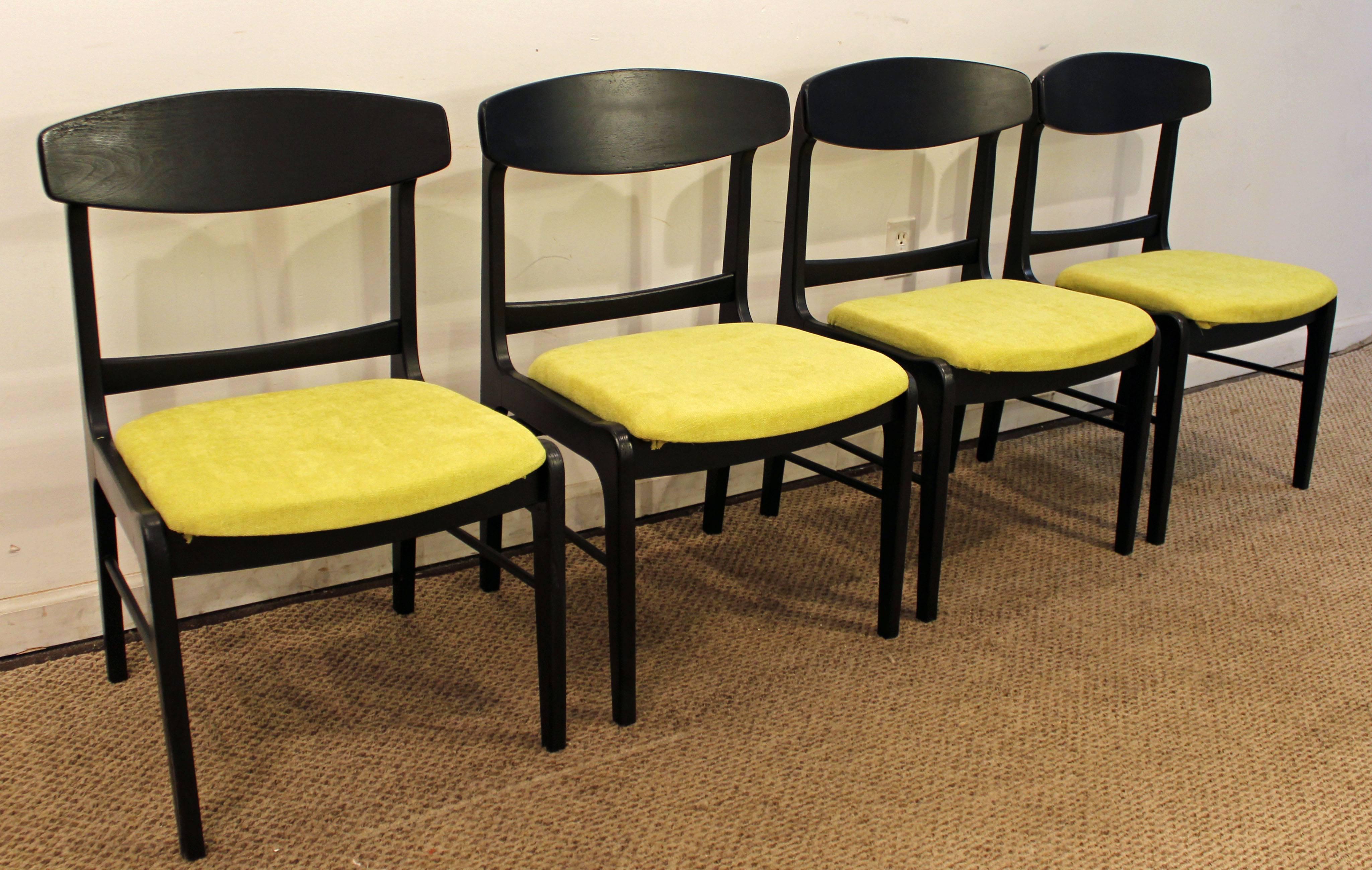Offered is a very nice set of four Mid-Century Modern curved-back dining chairs. These chairs have been repainted black and reupholstered with new 'Citron' fabric.

Dimensions:
21