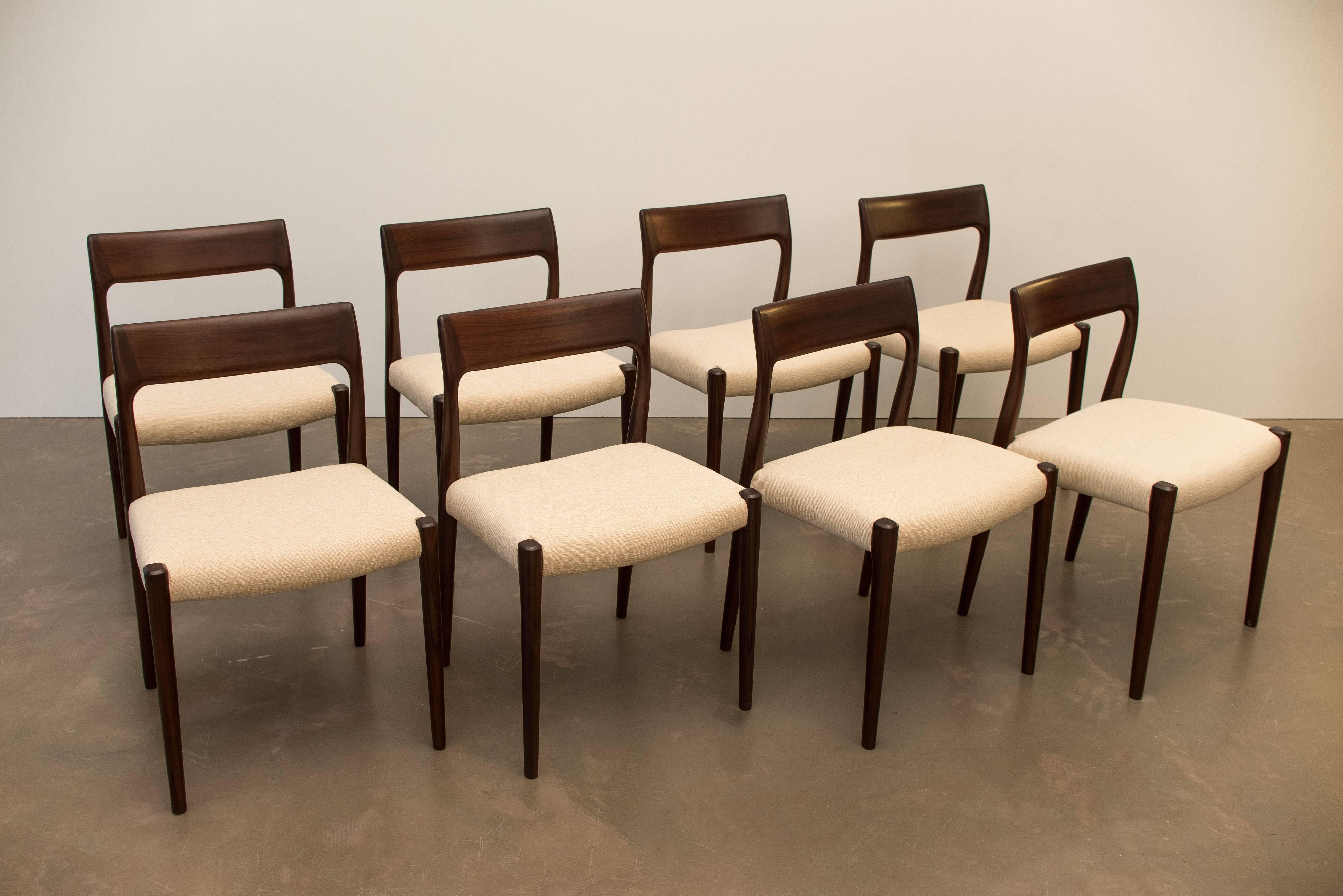 Set of eight dining chairs, designed by Nils Moller and manufactured by J.L. Møllers Møbelfabrik in the 1960s. The frames are made from solid rosewood wood and have new fabric upholstery.