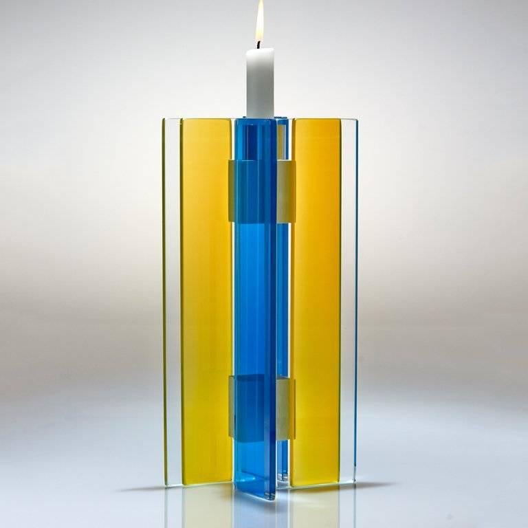 This Majestic series, polished glass candleholder is designed by world renowned glass artist, Sidney Hutter. With 40 years of experience in the contemporary glass and fine art world, Sidney now creates illuminated designs for the home. Create a