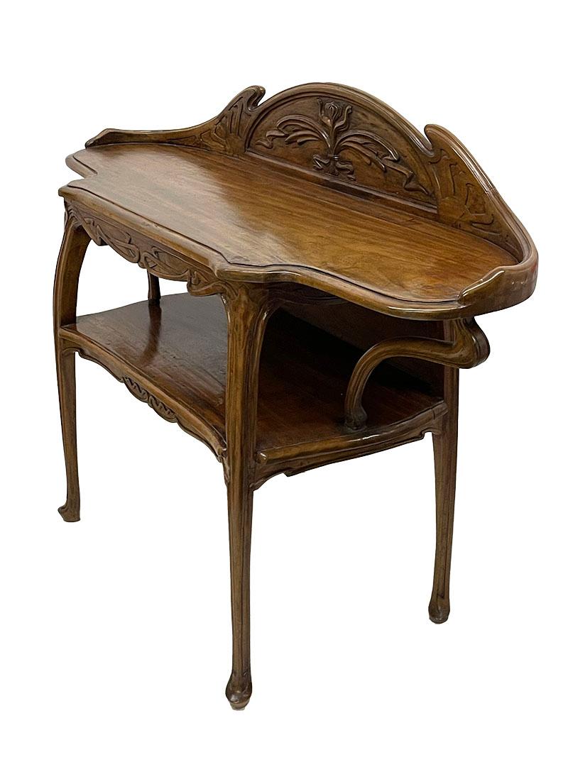 Art Nouveau wall side table, ca. 1900

A walnut side table, formerly used as a coffee/tea table. The table is decorated with Art Nouveau relief scenes featuring beautiful, graceful lines and flowers. The sides have elegant, reinforced Art Nouveau