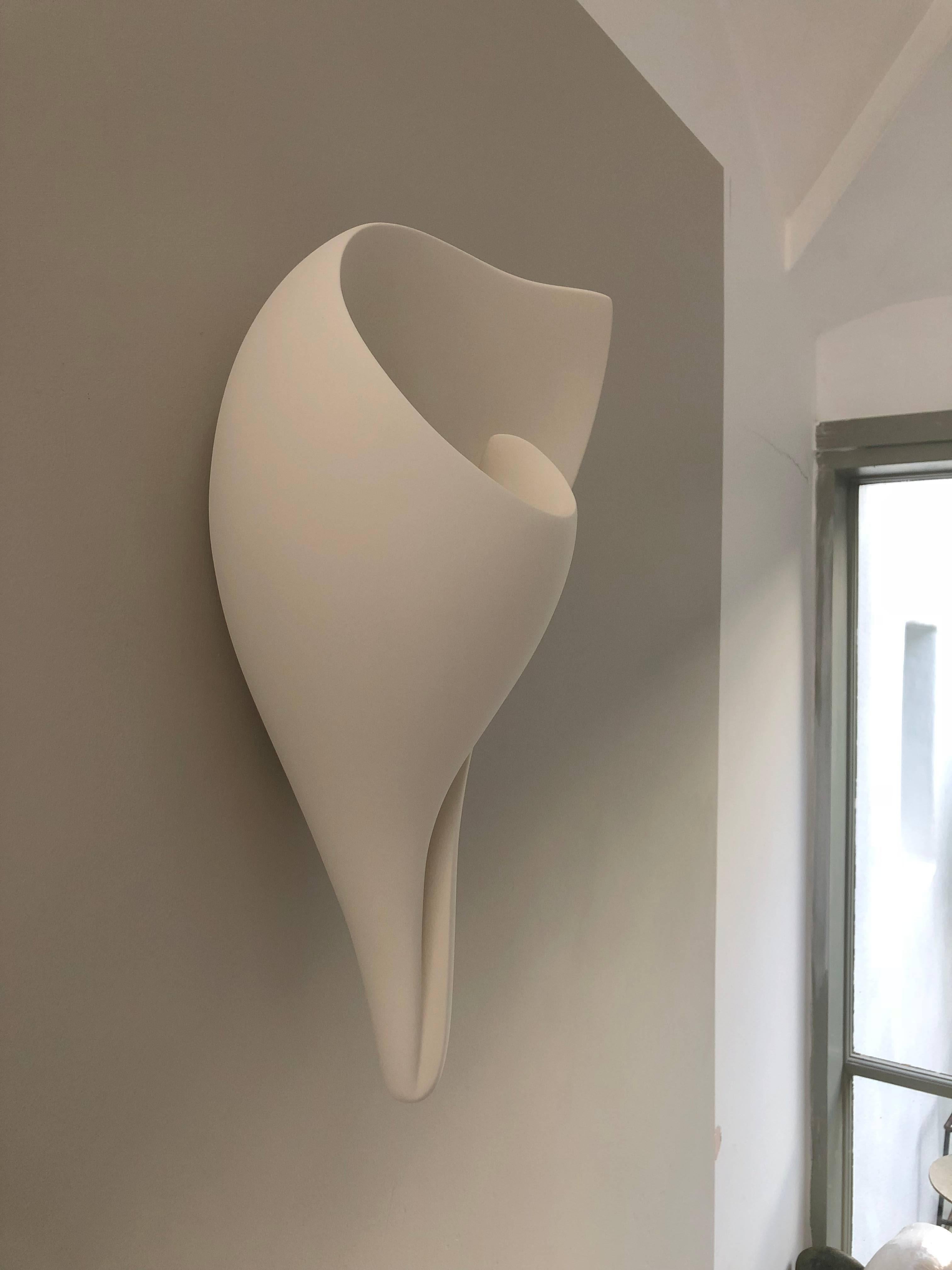 Handmade monumental shell wall-mounted sculpture, in silky smooth white plaster, created by artist Hannah Woodhouse in her London studio. Contemporary design inspired by nature and midcentury European sculpture. Height 19.7