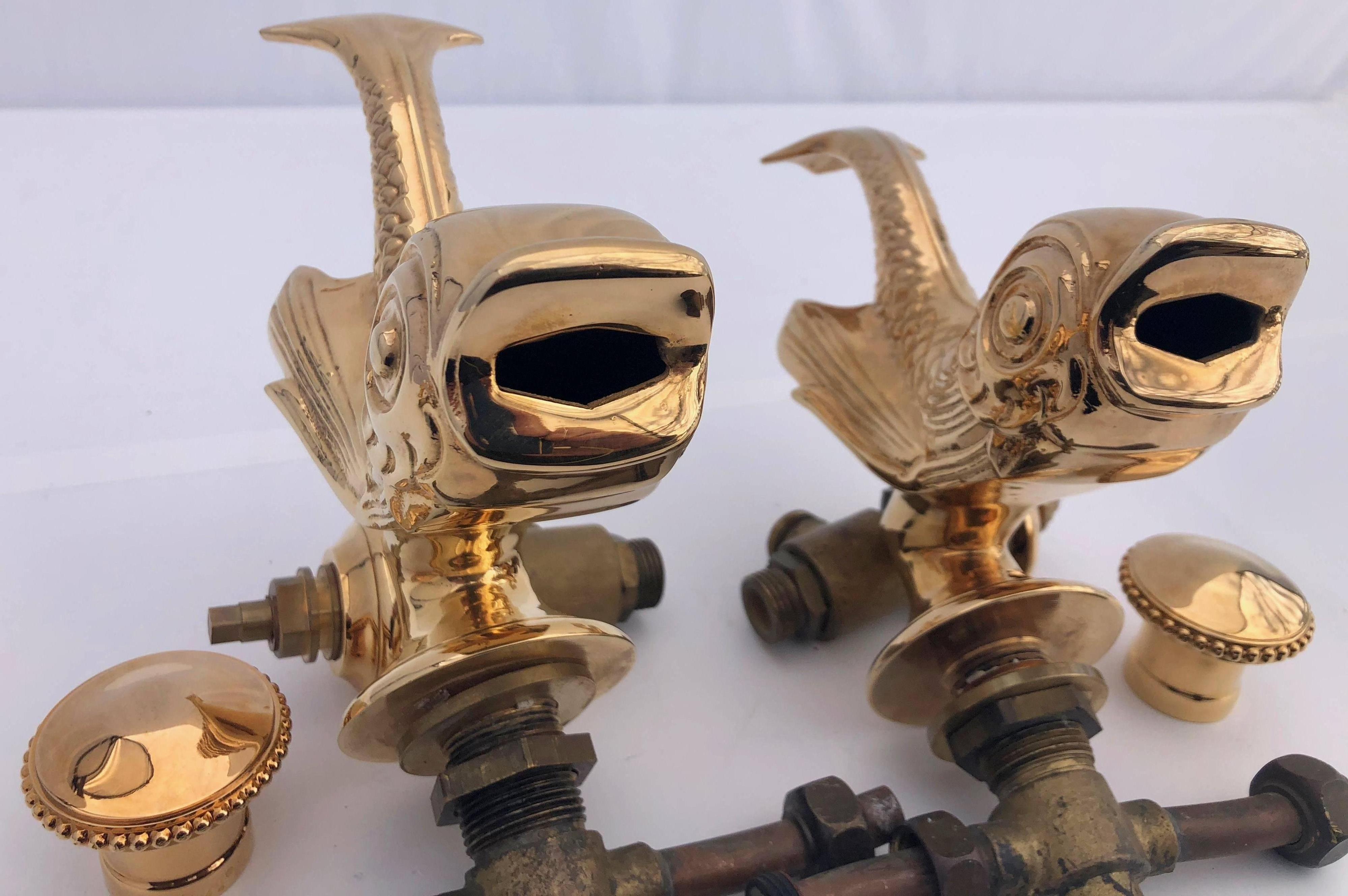 This gold-plated set of two faucets were custom-made for the opening of a famous Parisian restaurant in 1963 (La Marée rue Daru Paris 8). They were restored and plated with gold leaves in the 1980s and then never used. The dolphin figures are