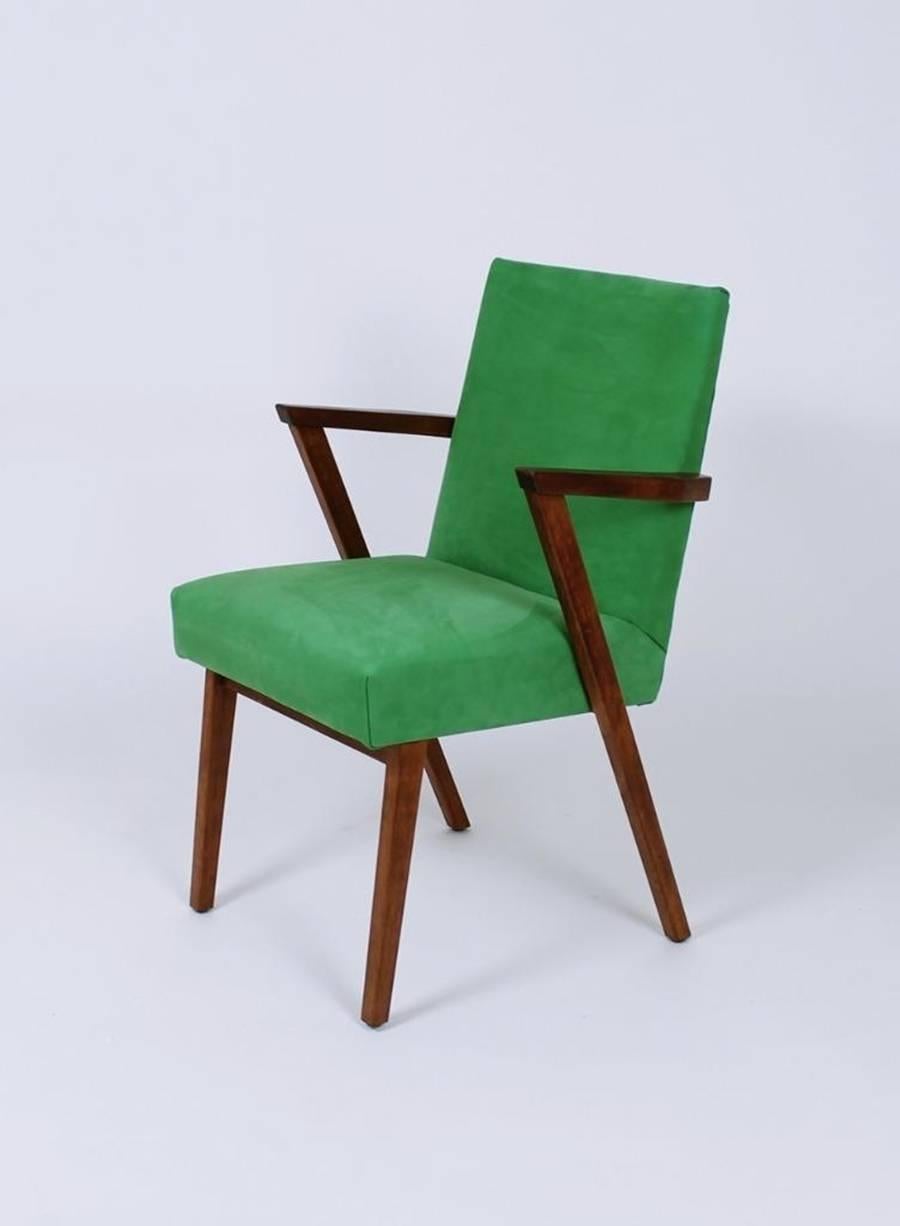 Stunning vintage Mid-Century Modern retro armchair with wedge shaped wood arms by Tijsseling. Newly upholstered in green Italian Nubuck leather.
 