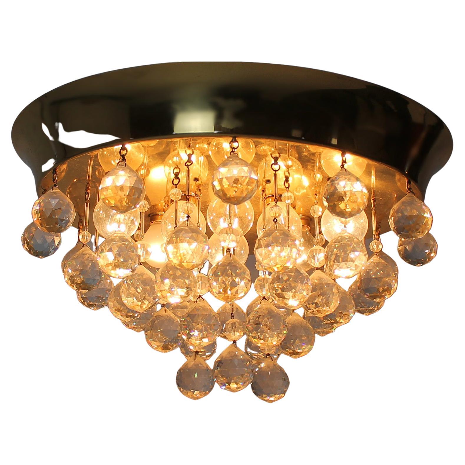 A very elegant and fine midcentury Flush Mount. Feature prismatic cut-glass balls and brass hardware. It holds up to nine bulbs ( E 14 ) . In a very good original vintage condition (no breaks, no chips, no repairs) wear consistent with age and use.