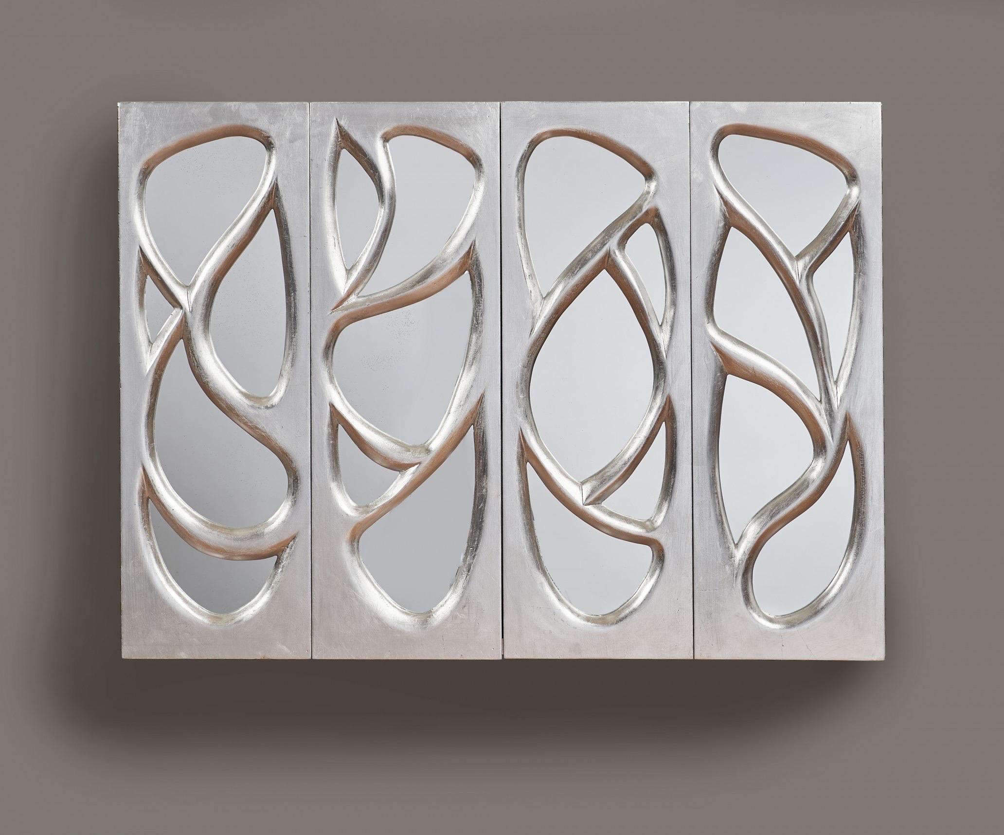 Phillip Lloyd Powell (1919-2008)

A rare and astounding hanging cabinet by Pennsylvania Studio Craft movement master Phillip Lloyd Powell, in sinuously sculpted wood covered in silver-leaf with mirrored inserts. With two hinged doors and a single