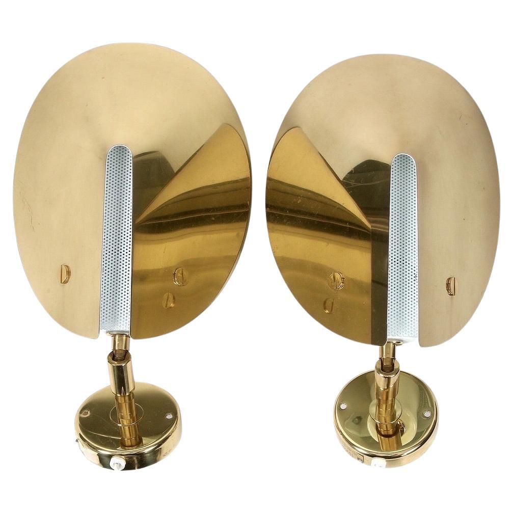 Pair of Aneta brass sconces, Sweden 1980, single candelabra socket with thick half cone shaped press brass shades with a white perforated center shade
Brass frame and brass finials.
The shades can be moved in their base depending on the angle you
