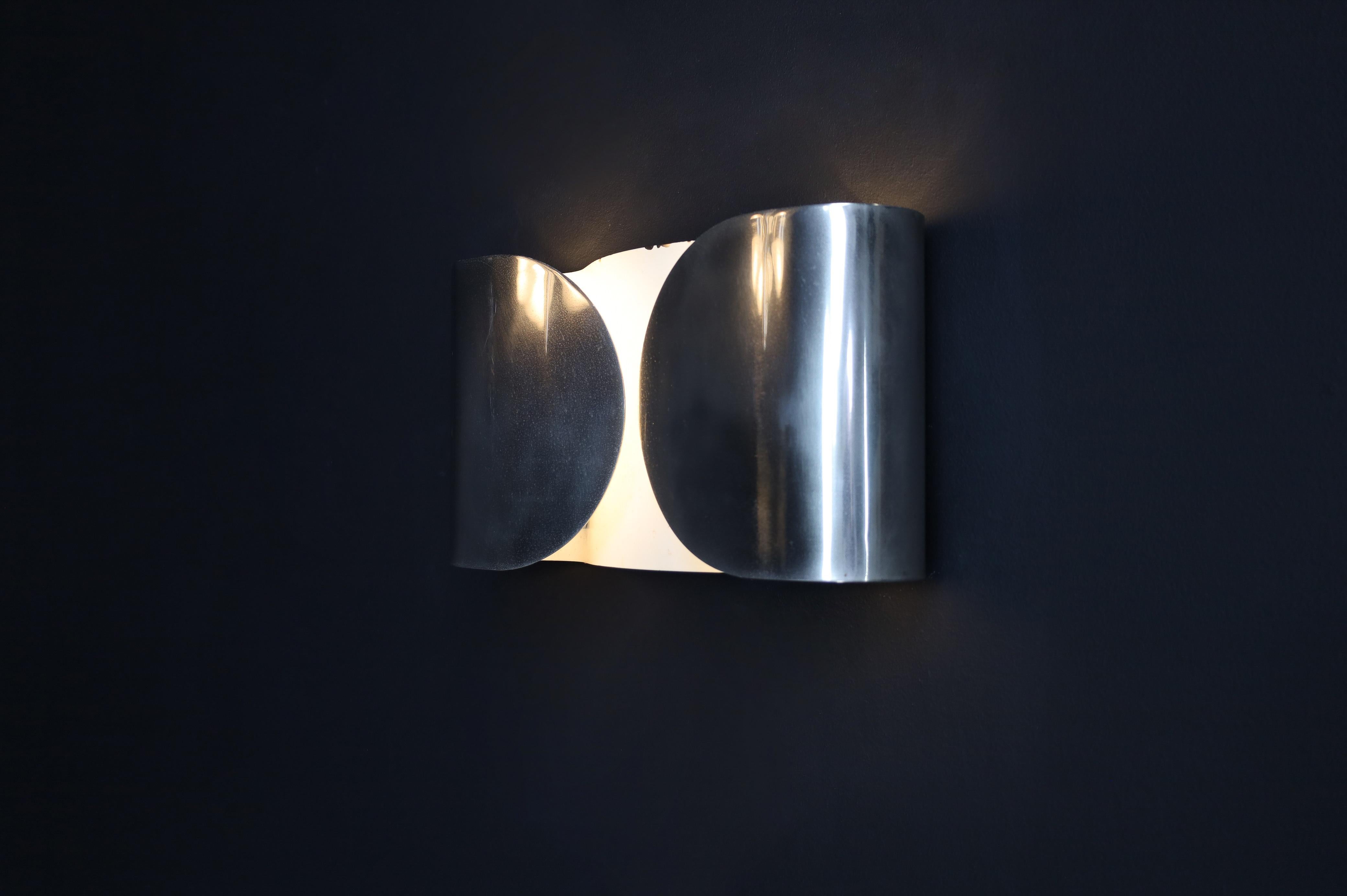 Patinated ‘Foglio’ Wall Lights by Tobia Scarpa for Flos, 1966 – Set of Four

Offered is a set of four original ‘Foglio’ wall lights, designed by Tobia Scarpa for Flos, Italy, in 1966. These iconic fixtures embody the refined minimalism of