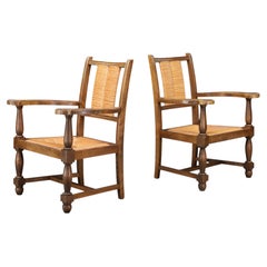 Pair of French Oak and Rush Armchairs in the Manner of Charles Dudouyt, France