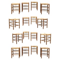 Set of 16 French Oak and Rush Stools in the Style of Charlotte Perriand France