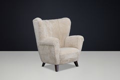 Art Deco Wingback Armchair in Cream Sheepskin, Europe, 1930s
