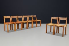 Conjunto de ocho sillas de comedor «Pierre Chapo» S24, de olmo y cuero color coñac, Francia, 1960