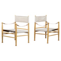 Paire de fauteuils « Safari » danois signés Farstrup, en toile et cuir, vers 1960