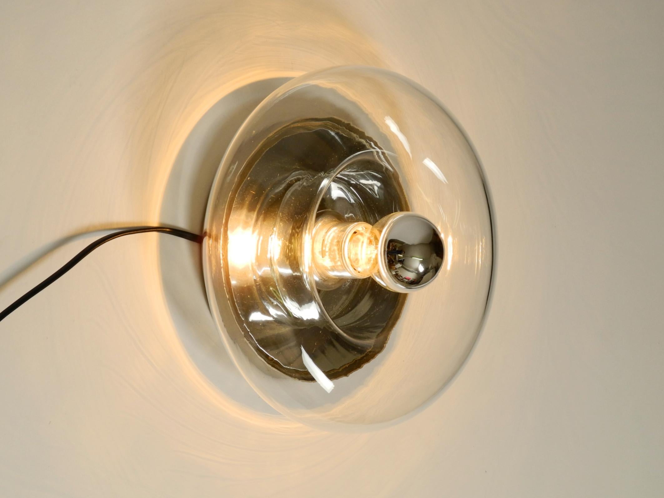 German Original 70s round donut wall or ceiling lamp made of transparent glass by Doria For Sale