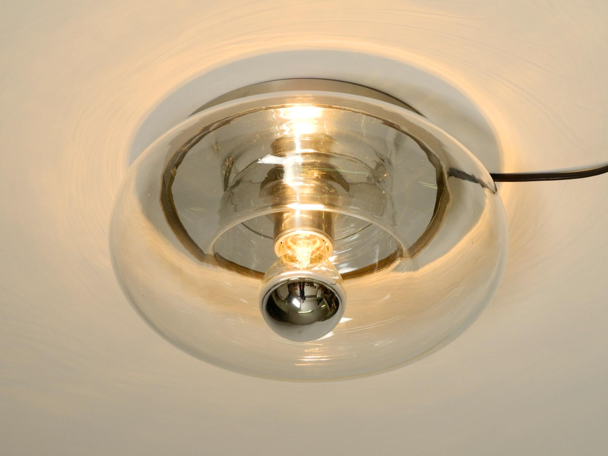 Original 70s round donut wall or ceiling lamp made of transparent glass by Doria In Good Condition For Sale In München, DE
