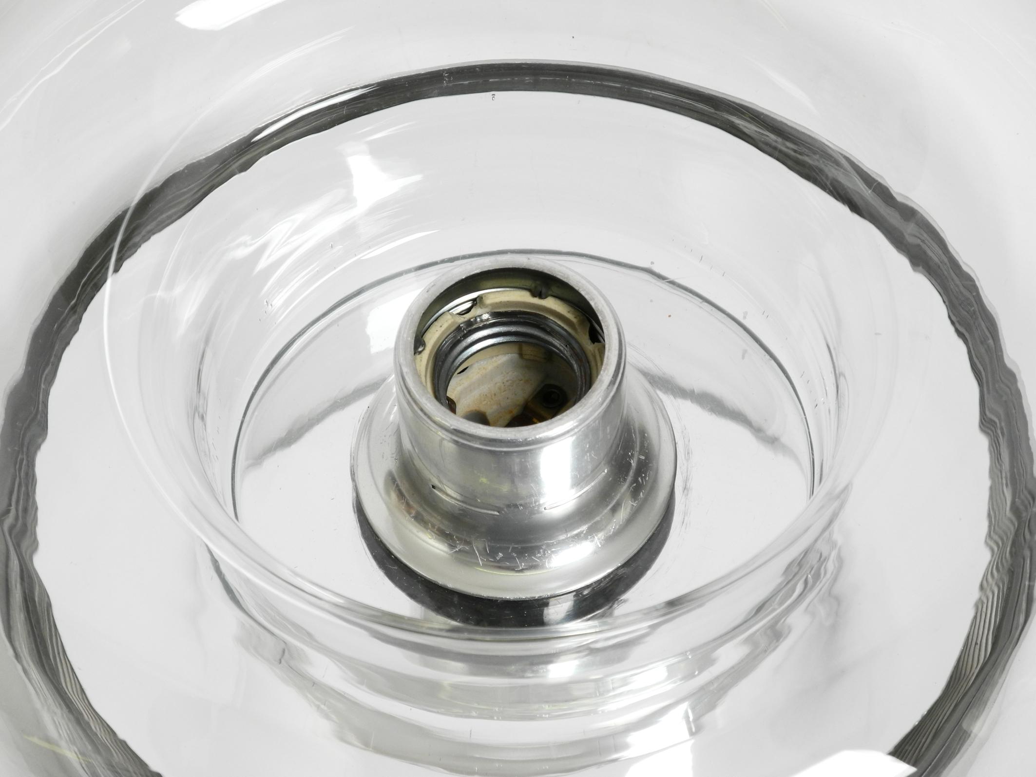 Original 70s round donut wall or ceiling lamp made of transparent glass by Doria For Sale 1
