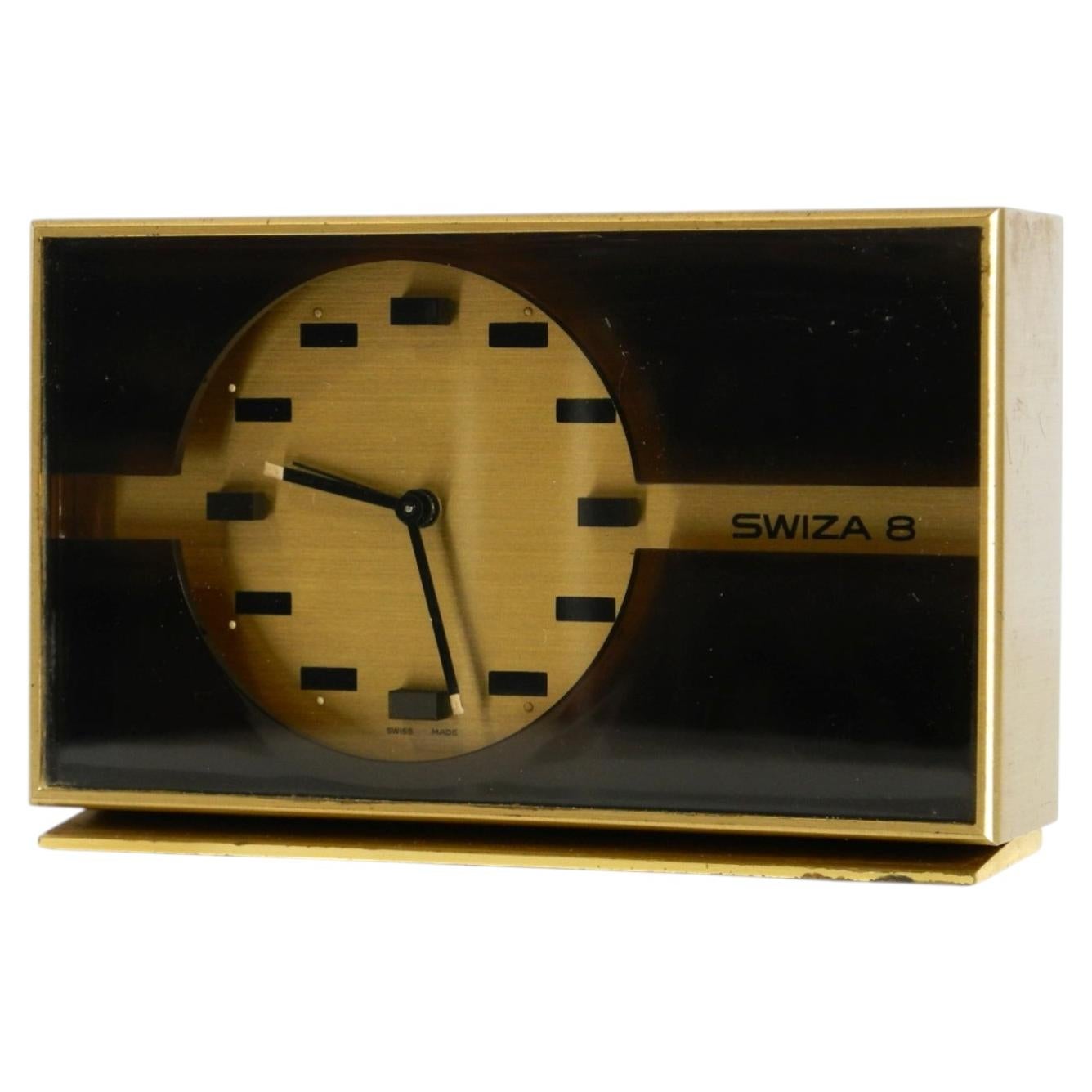 Swiss made, small, and rare original mechanical Swiza 8 table clock in brass For Sale