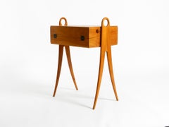 1950s ash sewing box, with a hinged top, multiple compartments, and curved legs