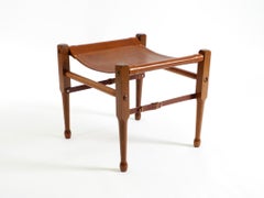 1990s safari stool with a teak frame and a seat made of brown saddle leather
