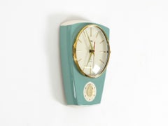 Battery-operated Mid-Century wall clock by Peter, with a glazed ceramic case