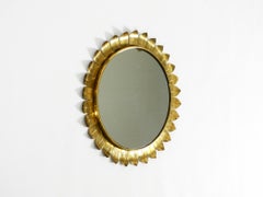 Beautiful round Italian sunburst wall mirror made of brass, Mid Century Modern