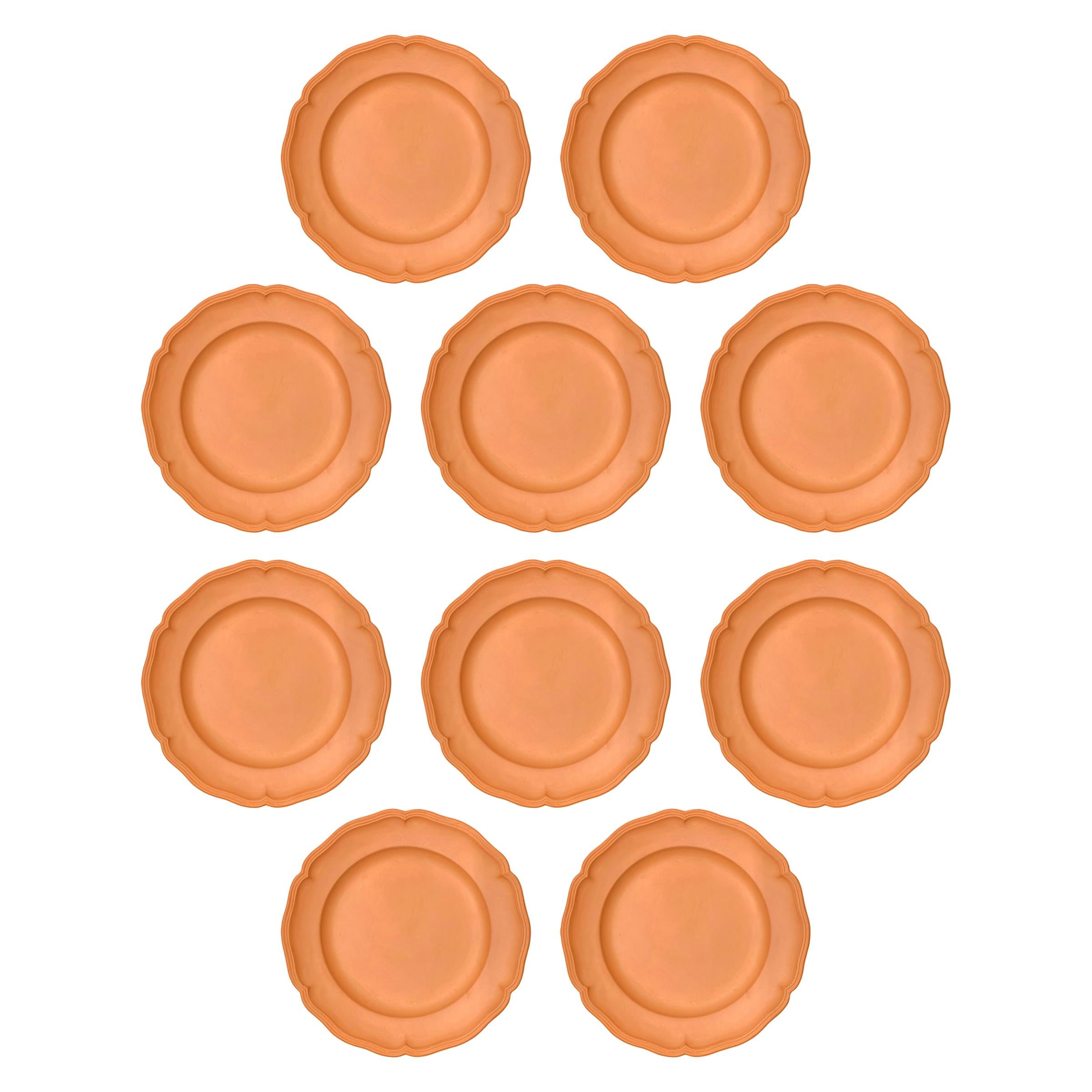 A set of ten vintage terracotta dinner plates with scalloped edges, perfect for your next garden party!