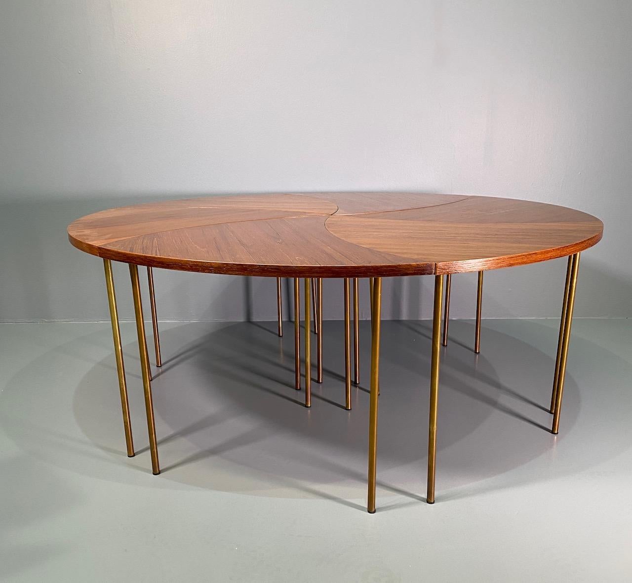 Solid teak segmented coffee table with brass legs by Peter Hvidt and Orla Mølgaard-Nielsen tables can be configured in several ways.