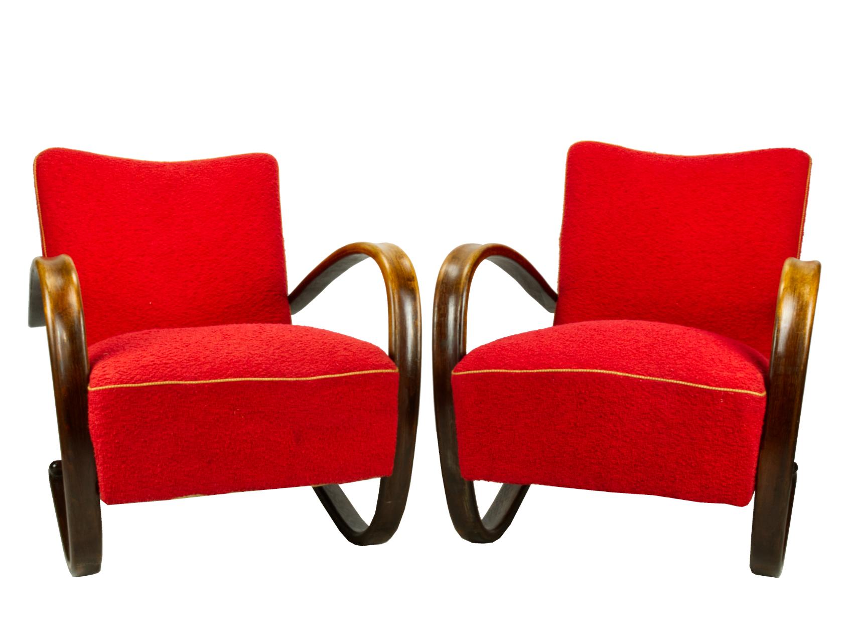 Pair of iconic H-269 lounge chairs by Jindrich Halabala for UP Závody Brno.
The chairs are in their original condition with visible traces of use. The construction is very strong, stable and in a good condition, but they need a new finish. 
An