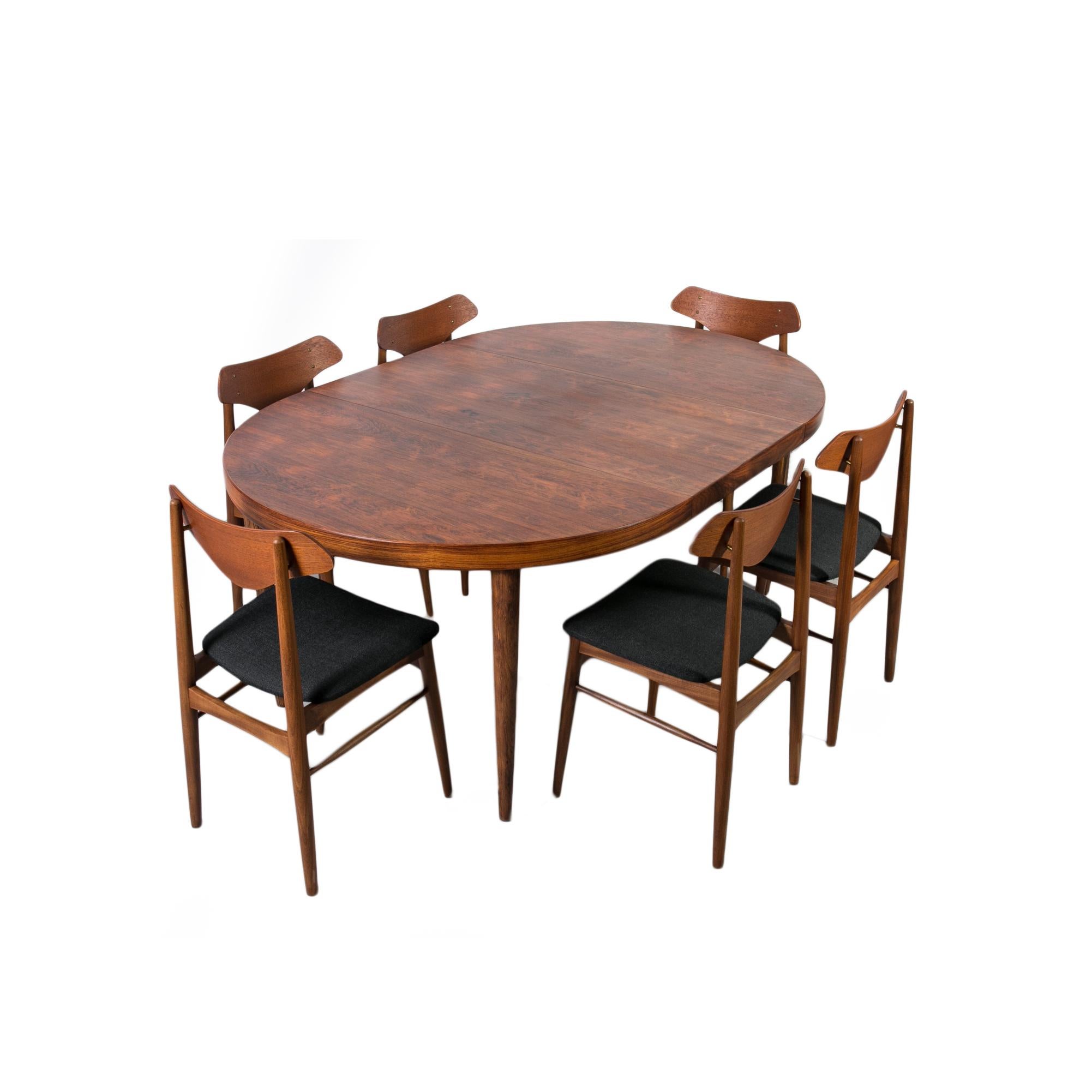This stunning dining set was made around the 1960s in Denmark, most probably by Farstrup Manufacture.

It includes six dining chairs and an extendable round dining table.

The table features one extension leaf, 55 cm wide, allowing it to expand from